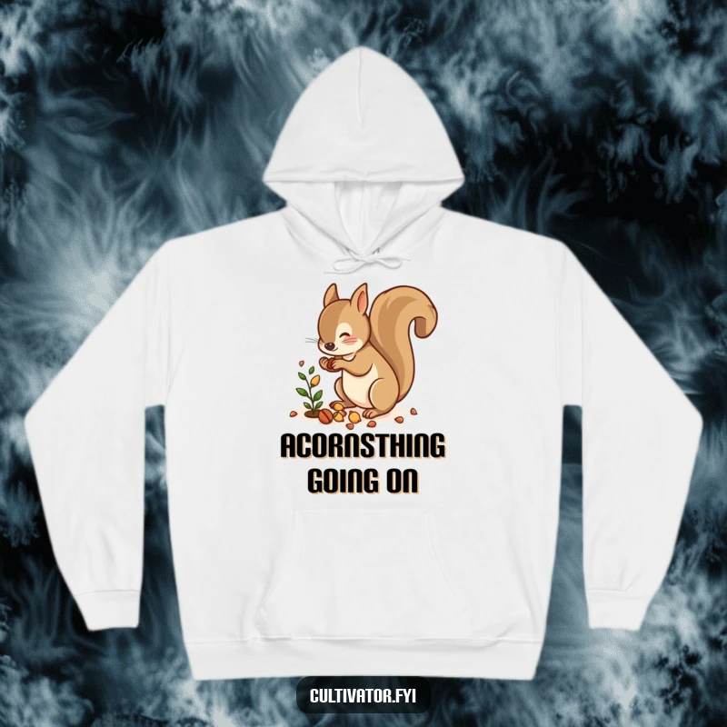 Funny hoodie featuring a lively squirrel scattering nuts near a small plant, perfect for cozying up with nature vibes.