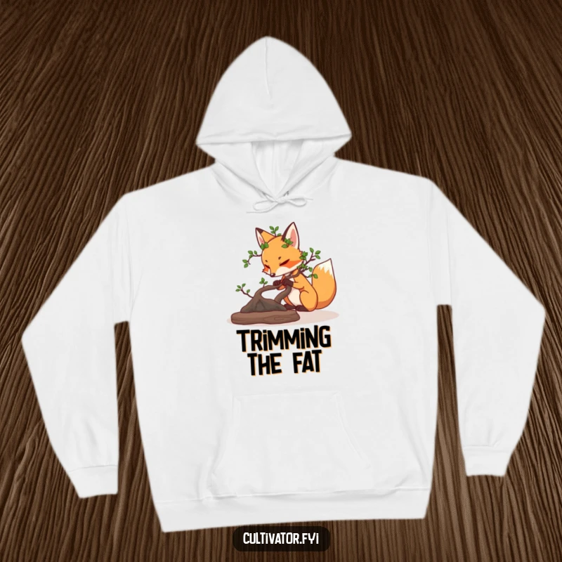 Funny determined fox carefully pruning a miniature bonsai tree hoodie, cozy and embodying mindful attention.