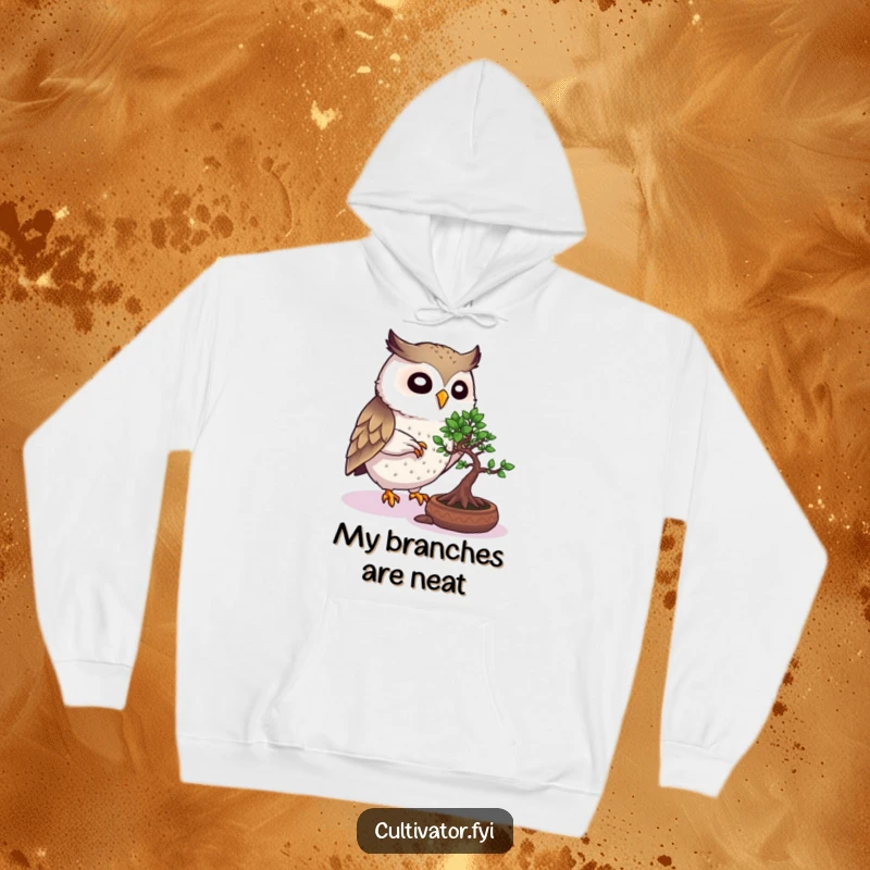 Funny Owl Hoodie: Lively owl attentively pruning a bonsai tree, radiating wisdom and a cozy, humorous vibe.